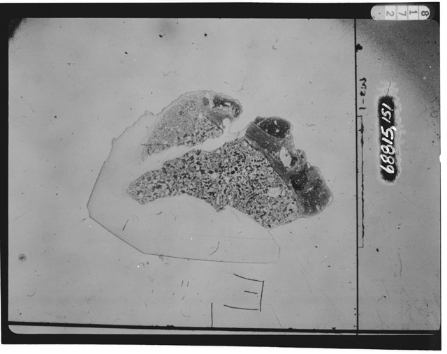 Black and white photograph of Apollo 16 Sample(s) 68815,151; Thin Section photograph using transmitted light.