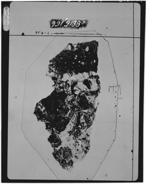 Black and white photograph of Apollo 16 Sample(s) 68815,156; Thin Section photograph using transmitted light.
