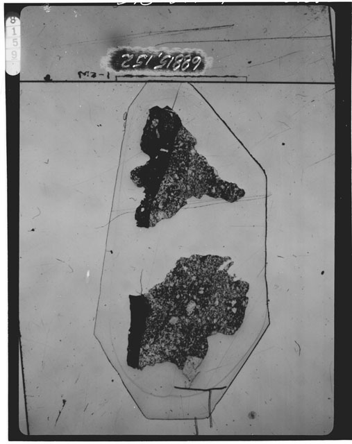 Black and white photograph of Apollo 16 Sample(s) 68815,152; Thin Section photograph using transmitted light.