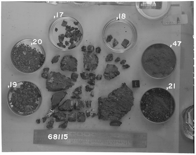Black and white photograph of Apollo 16 Sample(s) 68115,17-21,47; Processing photograph displaying chip, fragments and fines with an orientation of E.