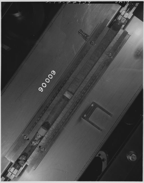Black and white photograph of Apollo 16 Core Sample 60006; Processing photograph displaying an overview of the Core Tube .