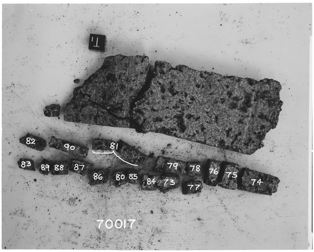 Black and white photograph of Apollo 17 Sample(s) 70017,73-90; Processing photograph displaying slab reconstruction with an orientation of T.
