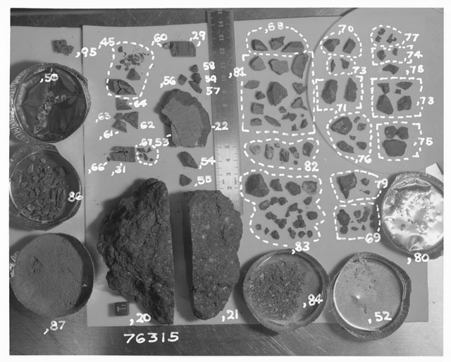 Black and white photograph of Apollo 17 Sample(s) 76315,20-22,29,31,45,50,52-64,66-71,73-84,86,87; Processing photograph displaying the orientation of chips, fragments and fines group.