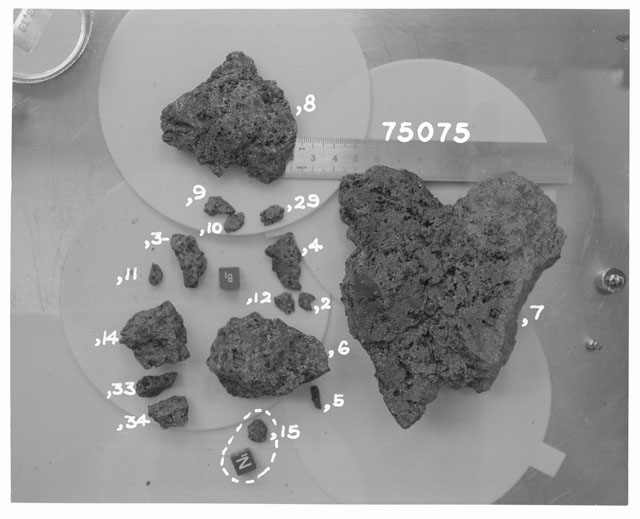 Black and white photograph of Apollo 17 Sample(s) 75075,2-12,14,15,29,33,34; Processing photograph displaying reconstruction.