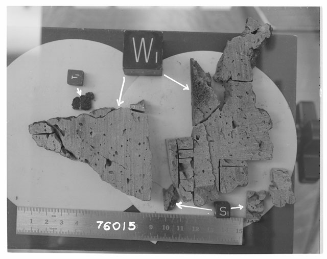 Black and white photograph of Apollo 17 Sample(s) 76015; Processing photograph displaying the orientation of a slab reconstruction.