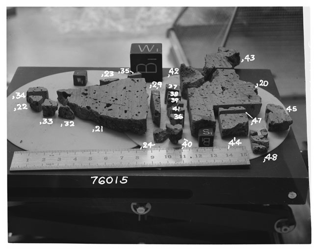 Black and white photograph of Apollo 17 Sample(s) 76015,20-24,29,32-45,47,48; Processing photograph displaying the orientation of a slab reconstruction.