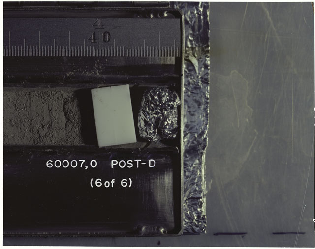 Color photograph of Apollo 16 Sample(s) 60007,0; 6 OF 6 Processing photograph displaying post dissection Core Tube .