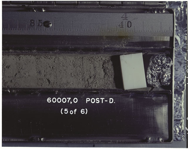 Color photograph of Apollo 16 Sample(s) 60007,0; 5 OF 6 Processing photograph displaying post dissection Core Tube .