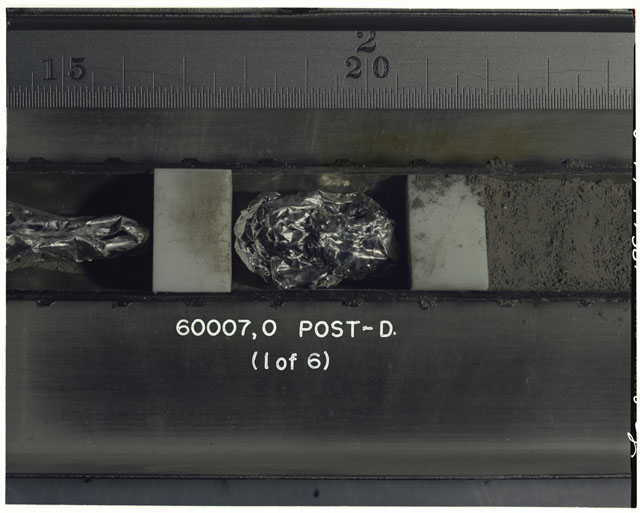 Color photograph of Apollo 16 Sample(s) 60007,0; 1 OF 6 Processing photograph displaying post dissection Core Tube .