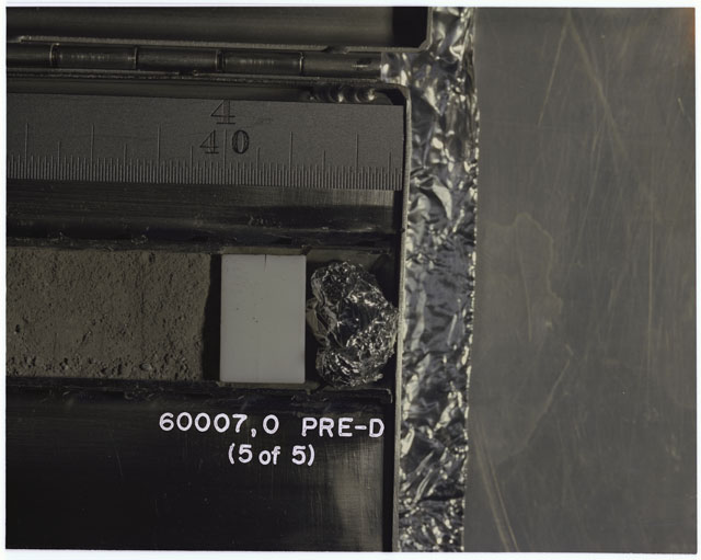 Color photograph of Apollo 16 Sample(s) 60007,1; 5 OF 5 Processing photograph displaying pre-dissection Core Tube .