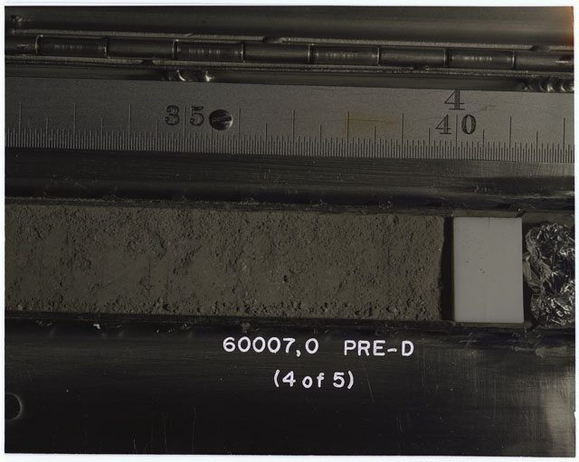 Color photograph of Apollo 16 Sample(s) 60007,0; 4 OF 5 Processing photograph displaying pre-dissection Core Tube .