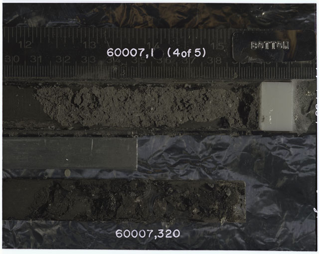 Color photograph of Apollo 16 Sample(s) 60007,1,320; 4 OF 5 Processing photograph displaying Core with peel at 30-39 cm depth.