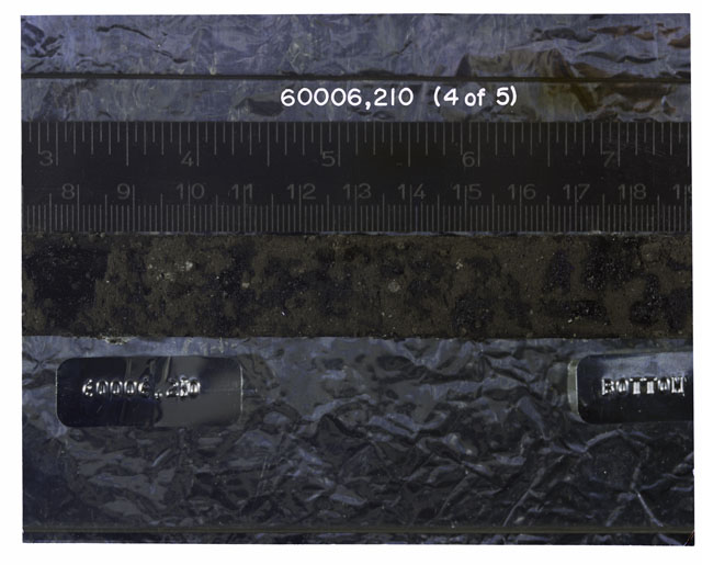 Color photograph of Apollo 16 Sample(s) 60006,210; 4 OF 5 Processing photograph displaying Core Tube at 7.5-19 cm depth.