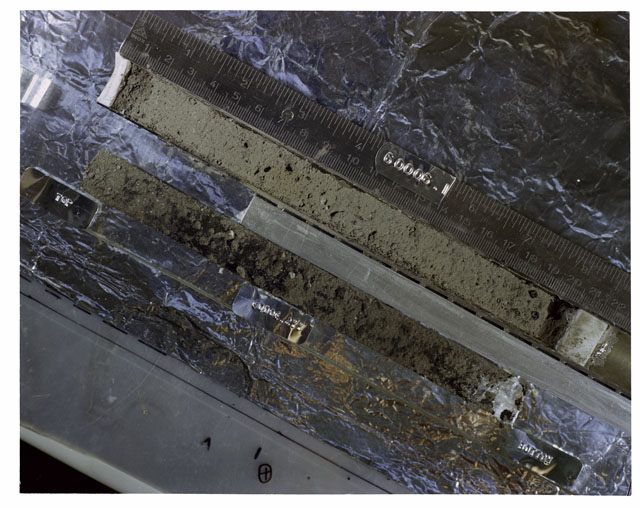 Color photograph of Apollo 16 Core Sample 60006,1,211; Processing photograph displaying an overview of the Core Tube with peel.