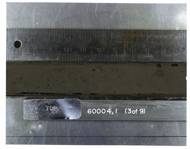 Color photograph of Apollo 16 Core Sample(s) 60004,1; 3 of 9 Processing photograph of the top of Core Tube at 7-17 Ccm depth.