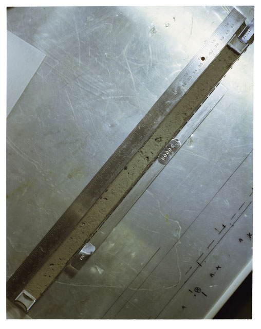 Color photograph of Apollo 16 Core Sample 60004,1; Processing photograph displaying an overview of the Core Tube .