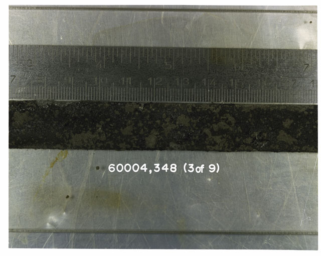 Color photograph of Apollo 16 Sample(s) 60004,348; 3 of 9 Processing photograph displaying Core Tube at 7-17.5 cm depth.