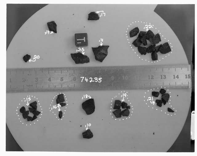 Black and white photograph of Apollo 17 Sample(s) 74235,4,10,14-22,25; Processing photograph displaying a post chip group with an orientation of T.
