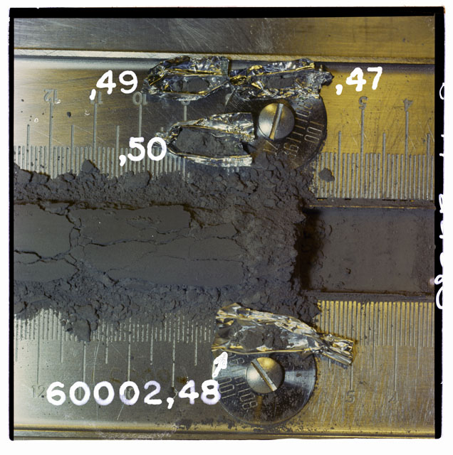 Color photograph of Apollo 16 Core Sample 60002,47,48,49,50; Processing photograph displaying with Core Tube removal of fines.