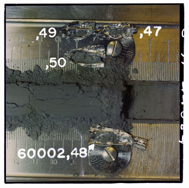 Color photograph of Apollo 16 Core Sample 60002,47,48,49,50; Processing photograph displaying with Core Tube removal of fines.