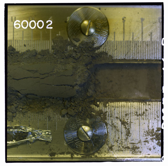 Color photograph of Apollo 16 Core Sample 60002,1; Processing photograph displaying Core Tube .