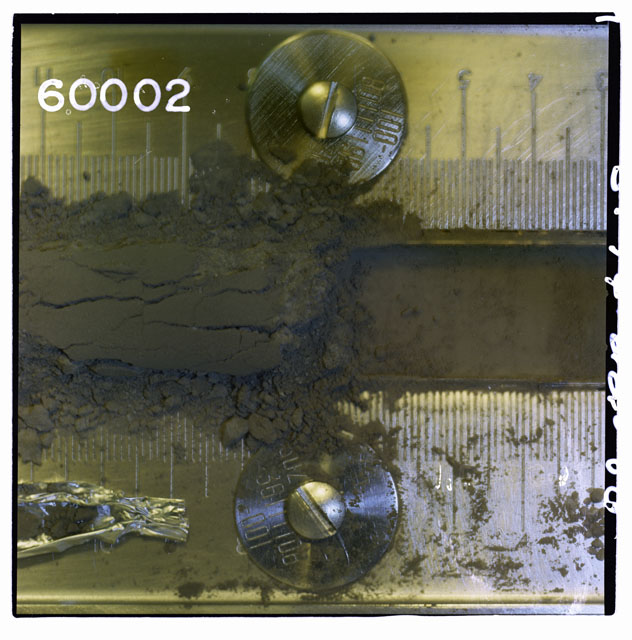 Color photograph of Apollo 16 Core Sample 60002,1; Processing photograph displaying Core Tube .