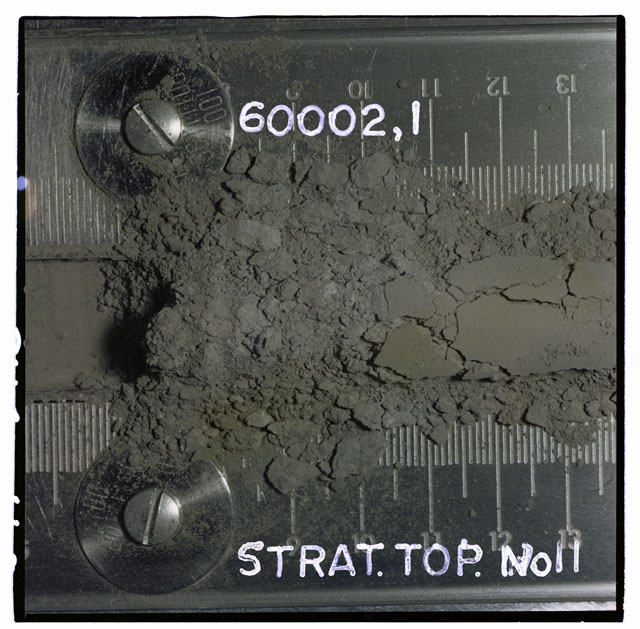 Color photograph of Apollo 16 Core Sample 60002,1; Processing photograph displaying Core Tube with strat top.