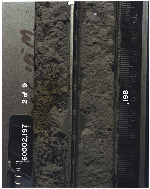 Color photograph of Apollo 16 Sample(s) 60002,197,198; 2 of 9 Processing photograph displaying Core Tube with peel at 25-33.5 cm depth.