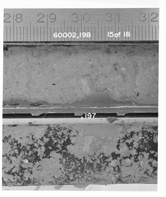 Black and white photograph of Apollo 16 Sample(s) 60002,197,198; 15 of 18 Processing photograph displaying Core Tube with peel at 28-32 cm depth.