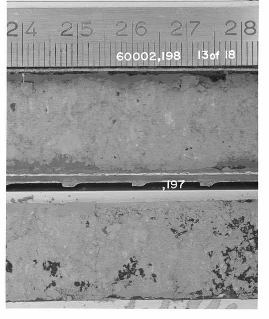 Black and white photograph of Apollo 16 Sample(s) 60002,197,198; 13 of 18 Processing photograph displaying Core Tube with peel at 24-28 cm depth.