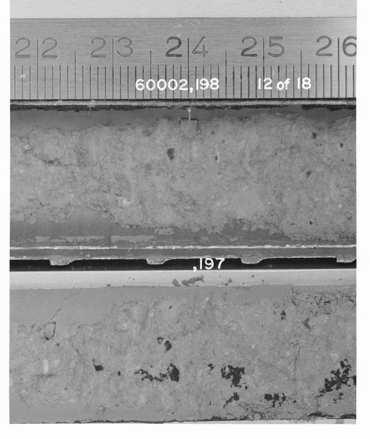 Black and white photograph of Apollo 16 Sample(s) 60002,197,198; 12 of 18 Processing photograph displaying Core Tube with peel at 22-26 cm depth.