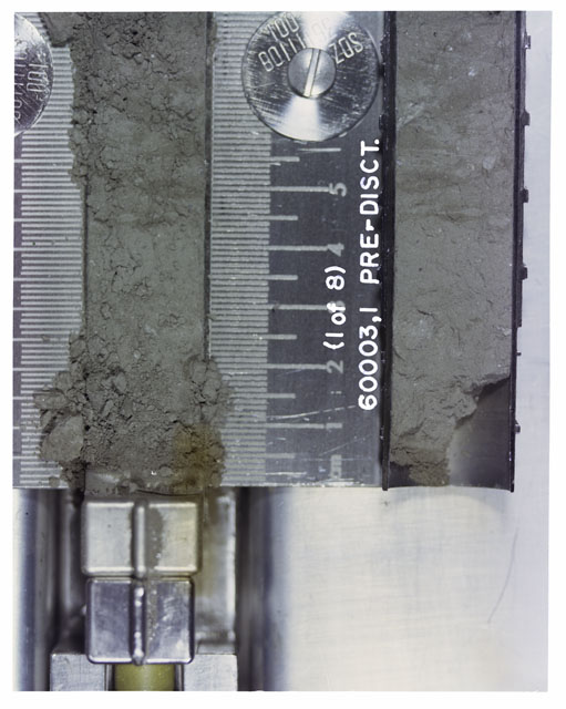 Color photograph of Apollo 16 Sample(s) 60003,1(1OF8); 1 of 8 Processing photograph displaying pre-dissection Core Tube at 0-7 cm depth.