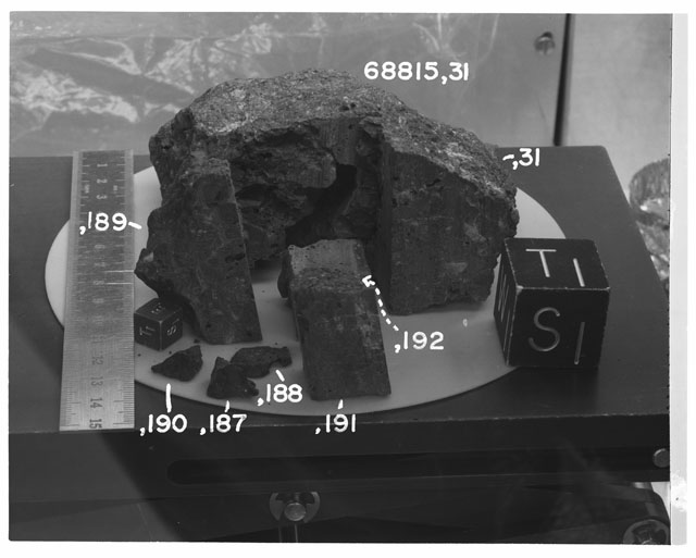 Black and white photograph of Apollo 16 Sample(s) 68815,31,187-192; Processing photograph displaying sawed surface with an orientation of S,T.