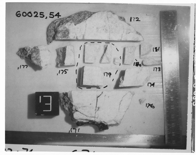 Black and white photograph of Apollo 16 Sample(s) 60025,54,171-177,179-181; Processing photograph displaying slab reconstruction with an orientation of E.