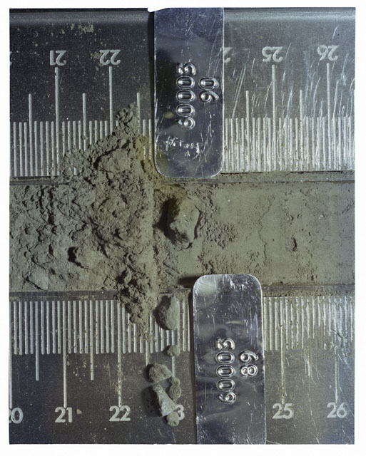 Color photograph of Apollo 16 Core Sample 60003,89,90; Processing photograph displaying Core Tube with removal of chips.