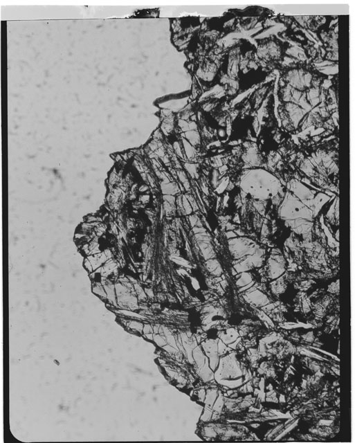 Black and white Thin section photograph of Apollo 12 Sample(s) 12002,318 using cross nichols light.