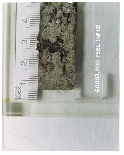 Color photograph of Apollo 16 Sample(s) 60003,200; 1 of 12 Processing photograph displaying Core Tube at 1-4.5 cm depth.