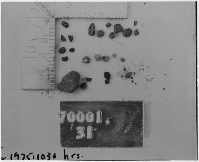 Black and white photograph of Apollo 17 Sample(s) 70001,31; Processing photograph displaying a group of <1 MM Core Fines.
