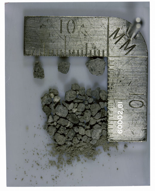 Color photograph of Apollo 16 Core Sample 60002,81; Processing photograph displaying >1 MM Core Fines .