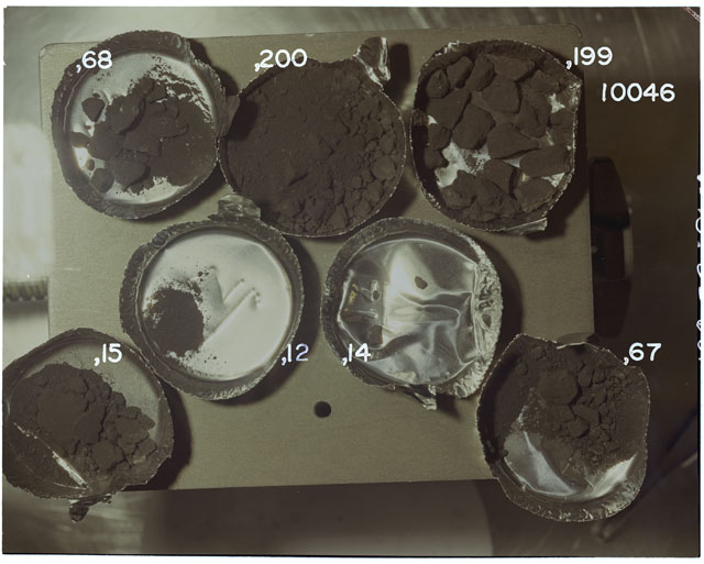 Color photograph of Apollo 11 Sample(s) 10046,12,14,15,67,68,199,200; Processing photograph displaying post chip with fines group.