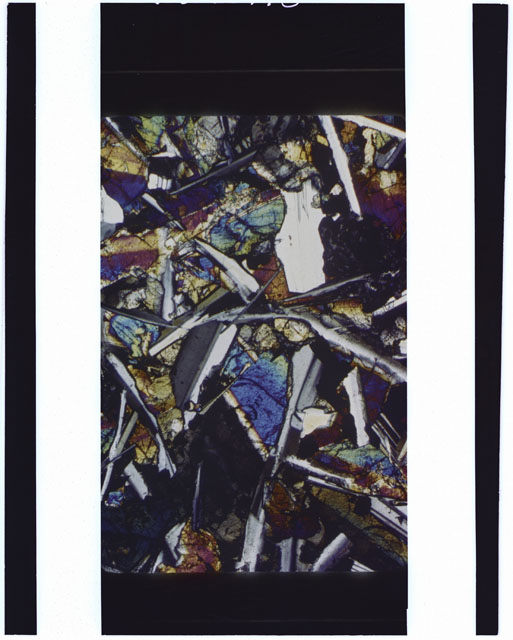 Color Thin Section photograph of Apollo 12 Sample(s) 12051 using cross nichols light.