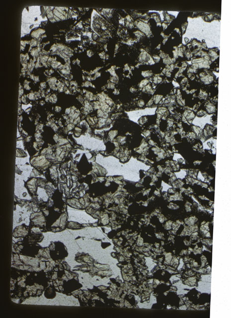 Color photograph of Apollo 11 Sample(s) 10017; Thin Section photograph using reflected light.