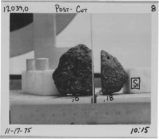 Black and white photograph of Apollo 12 Sample(S) 12039,0,18; Processing photograph displaying a post cut sample with an orientation of S.