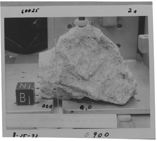 Black and white photograph of Apollo 16 Sample(s) 60025,0; Processing photograph displaying cutting.