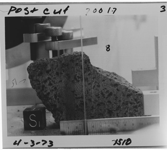 Black and white photograph of Apollo 17 Sample(s) 70017,8; Processing photograph displaying post-cut sample with an orientation of S.