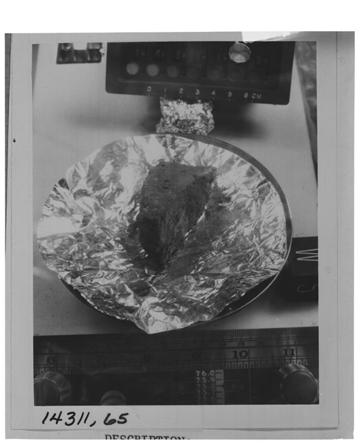 Black and white photograph of Apollo 14 Sample(s) 14311,65; Processing photograph displaying weighing  of sample with an orientation of W,S.