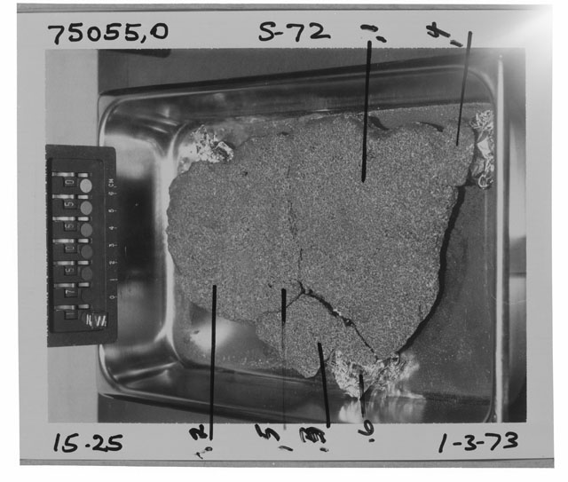Black and white photograph of Apollo 17 Rake Sample(s) 75055,0,1-6; Processing photograph displaying the orientation of pre-cut Cow Cake sample.