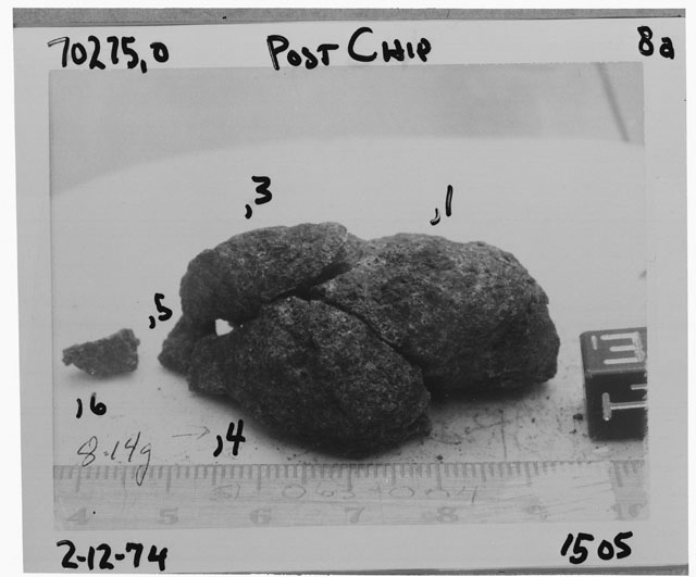 Black and white photograph of Apollo 17 Sample(s) 70275,1,3-6; Processing photograph displaying a post-chip reconstruction with an orientation of E.