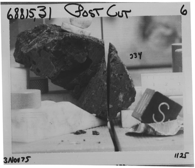 Black and white photograph of Apollo 16 Sample(s) 68815,31,234; Processing photograph displaying post cutting with an orientation of S,W.