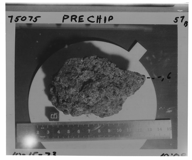 Black and white photograph of Apollo 17 Sample(s) 75075,6; Processing photograph displaying a pre chip sample with an orientation of B.